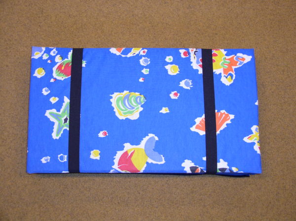 Fabric-covered, foldable mat 120x53x1 cm